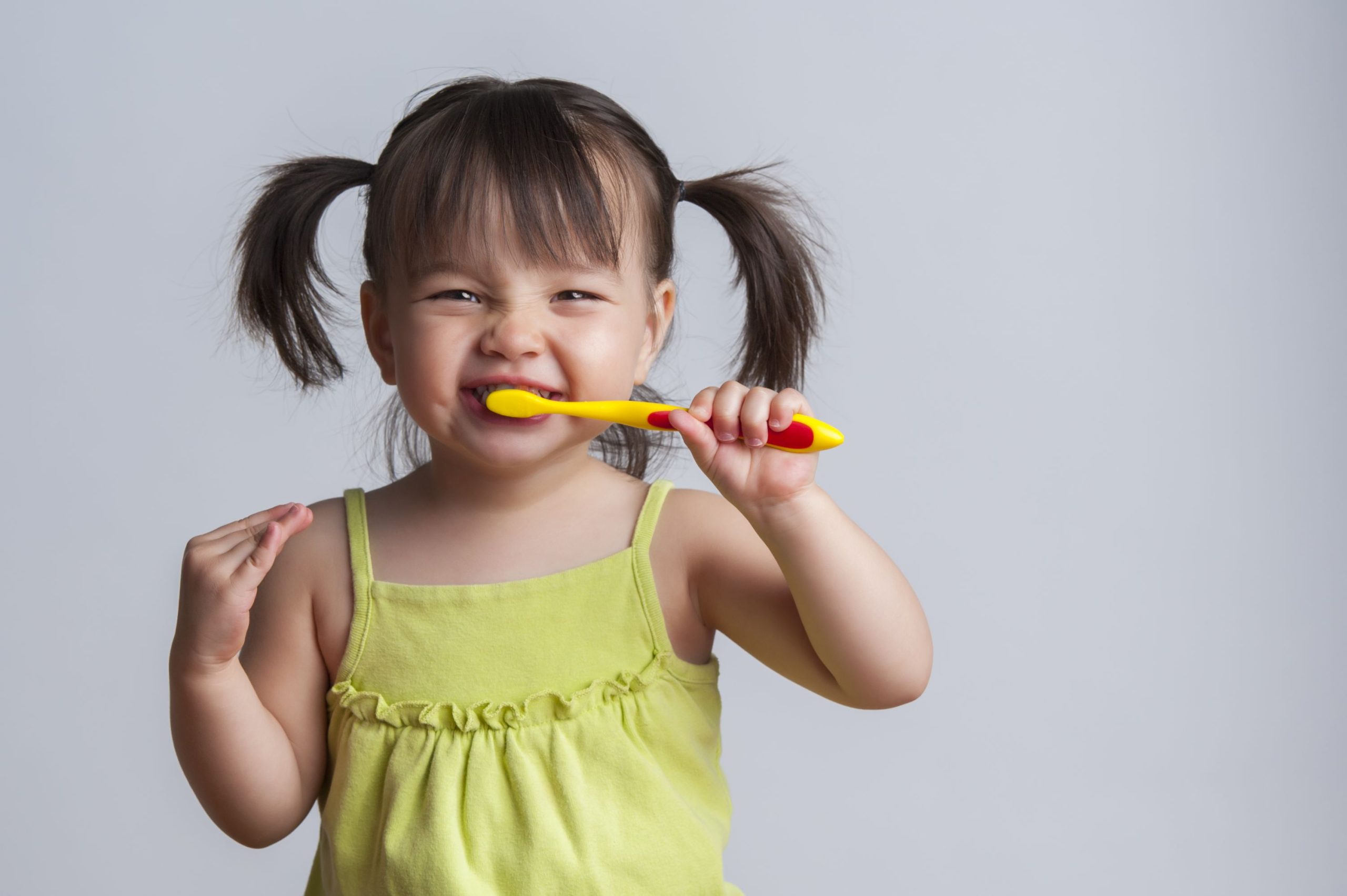 child brushing teeth